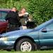 Washtenaw County Sheriff investigators retrieve a gun near vehicles parked in front of a home on Tyler Rd. on Wednesday, August 21, 2013. Melanie Maxwell | AnnArbor.com